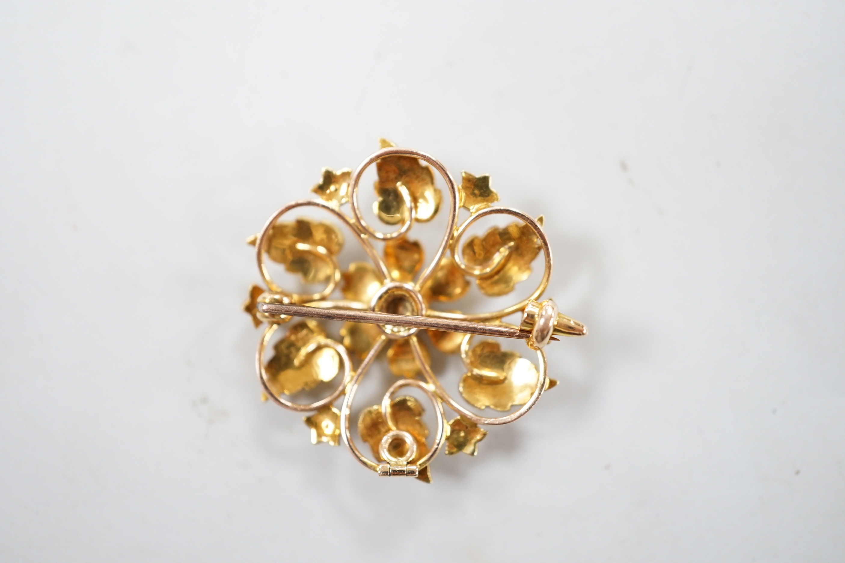 An Edwardian 15ct and seed pearl cluster set flower head brooch, 28mm, gross weight 6.3 grams.